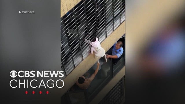 Dangling toddler rescued in China