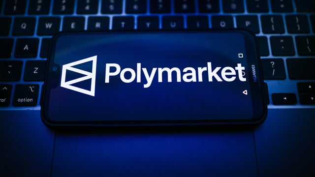In this photo illustration, a Polymarket logo is seen 