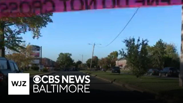Baltimore officer shot an armed man near shopping center, police say
