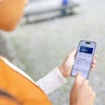 Woman checking her financial accounts on a smartphone 