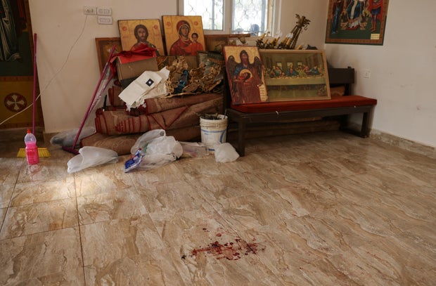 The grounds of Saint George's Greek Orthodox Church, where gunmen opened fire during a funeral the previous day, in the village of Hamoud
