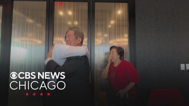 Son surprises father at 80th birthday dinner