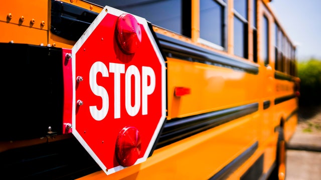 Stop sign on school  bus with selective focusing and with copy space 