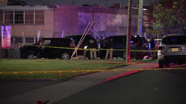Police vehicles and crime scene tape 