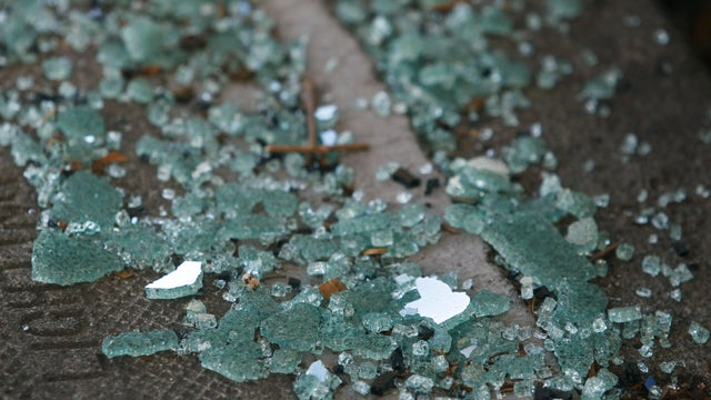 Shattered glass from a recent car break-in remains on the sidewalk on Bay Street near Kearny Street in San Francisco, Calif. on Wednesday, Sept. 9, 2015. Police officials say auto burglaries have doubled from last year, especially along Bay Street in Fish 